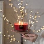 Bahoma Spirit of Christmas candle held in hand – festive gift moment